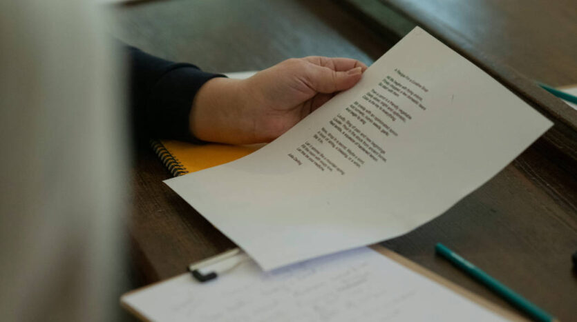 Person reviewing Spanish business contracts and financial documents as part of due diligence