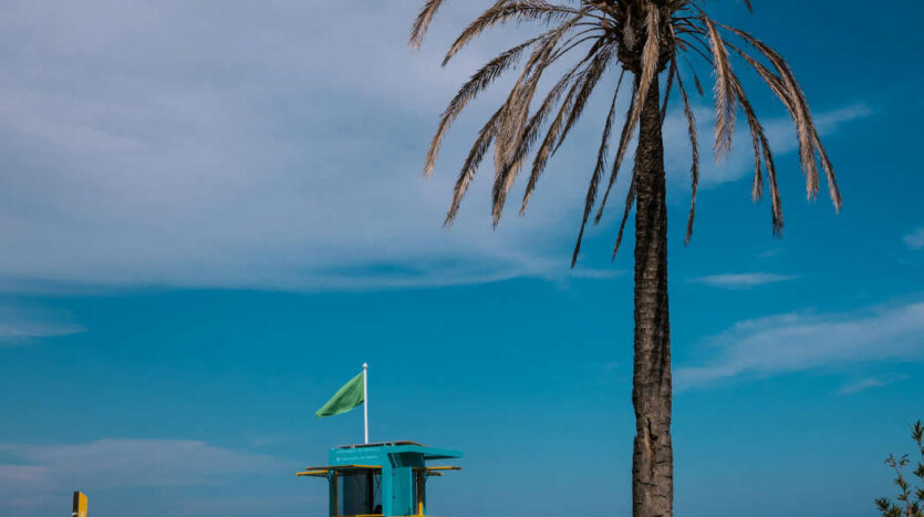 Tourists enjoying a sunny beach on the Costa del Sol in southern Spain